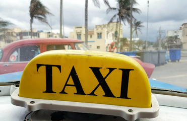 Yellow taxi sign