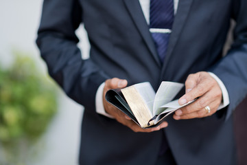 Reading the book. Bible book. Open book in hands. holding a bible