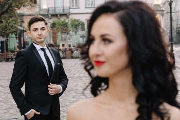Bride and groom walking through the old town