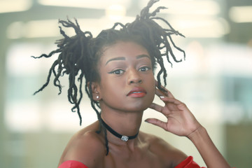 Black female with dreadlocks buns