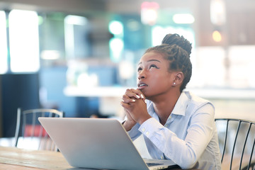 Black female praying and looking up