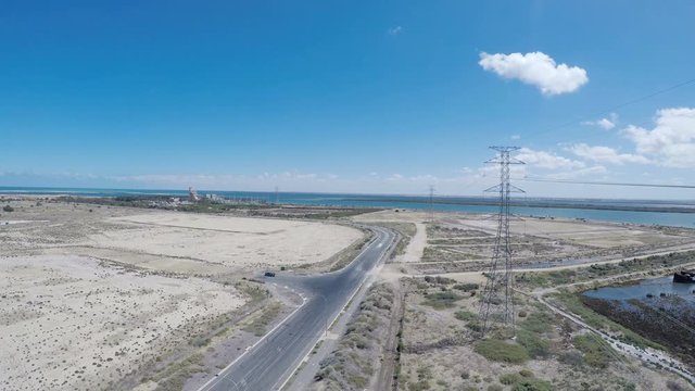 Drone footage of remote industrial area near power station and high-voltage towers, taken at Outer Harbor, Port Adelaide, South Australia.