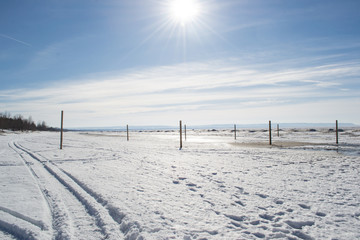 Winter beach with footprints