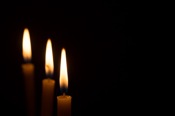 Several designs of candle light on dark background