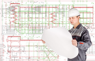 male architect in helmet with blueprint