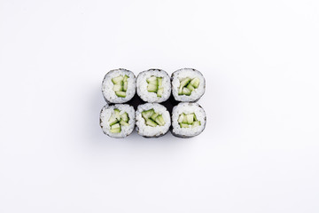 Classic mini sushi rolls with cucumber top view.