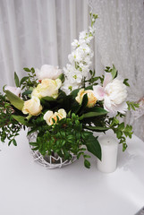 Wedding Floral Arrangement. Colorful Still life with Roses in Glass vase with White background. Party Table Decoration.