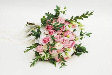 Obraz na płótnie Canvas Fresh Wedding Bouquet made from Pink and White Roses, Eustoma and Eucalyptus Leaves, beautiful isolated flowers