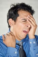 Stressed Latino Business Man Wearing Tie