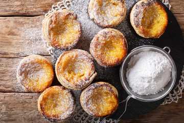 Portuguese pastries Pastel de nata with custard cream close-up. Horizontal top view