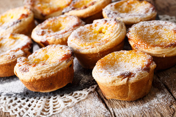 Delicious cakes Pastel de nata with custard cream close-up on the table. horizontal