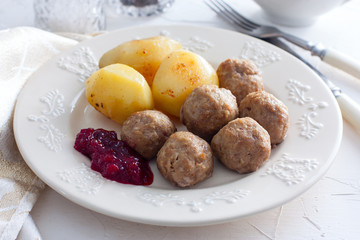 Swedish meatballs with cream sauce and cranberry jam, horizontal