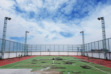 waste tennis court with ground breaking and waterlogging. the old condition deteriorated tennis court