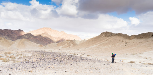 Trekking in Negev dramatic stone desert, Israel