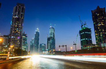 Fototapeta na wymiar Traffic in Dubai, night scene with light trails