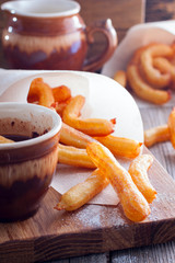 Churros - Spanish dessert from a custard batter, selective focus