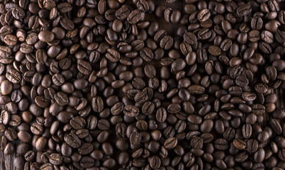 roasted coffee beans on wood texture