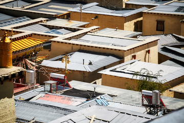 Aerial picture of roofs made or corrugated sheets, abstract urban background.