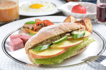 Fruit with tuna salad sandwich on the plate