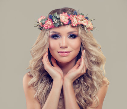 Young Woman with Spring Flowers. Facial Treatment, Aesthetic Medicine and Cosmetology Concept