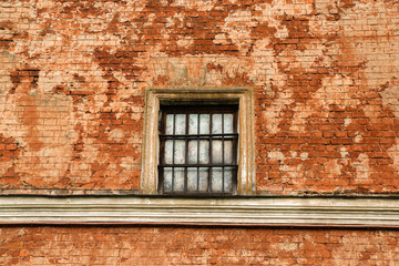 Window on vintage red brick wall