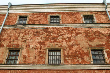 Windows on vintage red brick wall