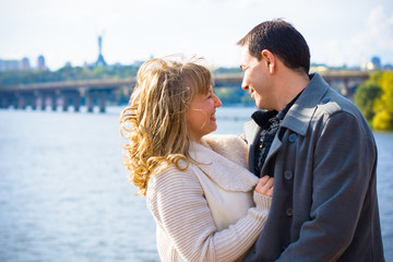 Fototapeta premium A middle-aged couple in love enjoys each other in embraces. The concept of relations without barriers, love and sincerity are all that is needed for happiness 