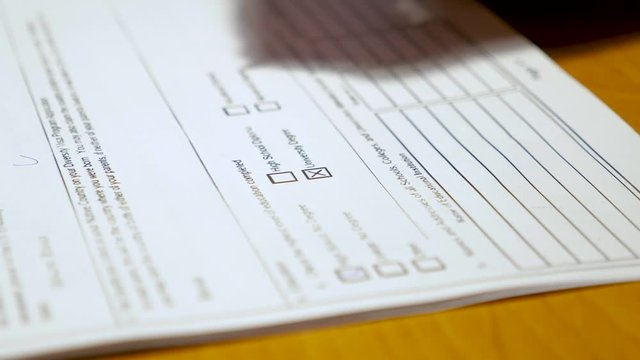 the person fills in the questionnaire close up
