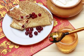 Pancakes on Maslenitsa, with cranberries and cottage cheese