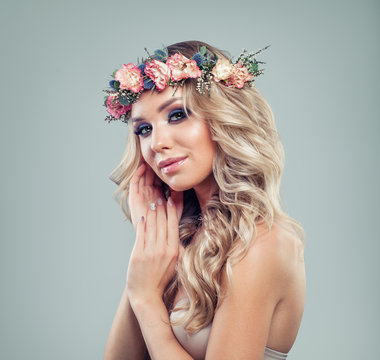 Summer Woman with Makeup, Curly Hair and Flowers. Young Beauty