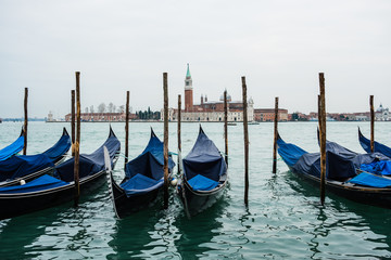 Obraz na płótnie Canvas Traditional Venetian Gondolas in Venice, Italy