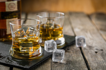 Bourbon on rustic wood background