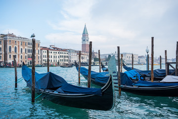 Fototapeta na wymiar Venetian Gondolas over the Grand Canal in Venice, Italy