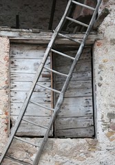 very old wooden ladder and a door in the farm