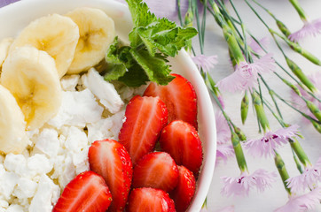 Healthy breakfast, cottage cheese with fruit.