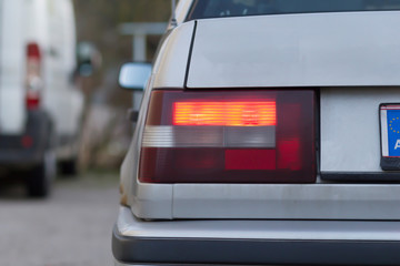 Rear flashing indicator light on a car