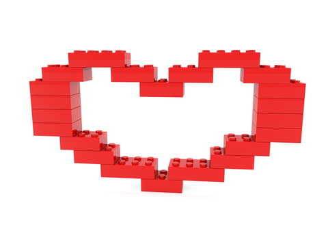 Red heart built from toy bricks with empty middle