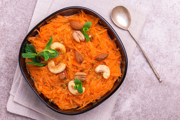 Indian carrot Gajar halwa. Copyspace, top view, flatlay.