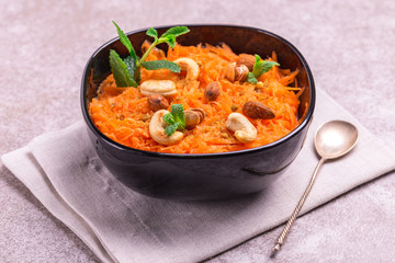 Indian carrot Gajar halwa. Copyspace, horizontal view, flatlay.