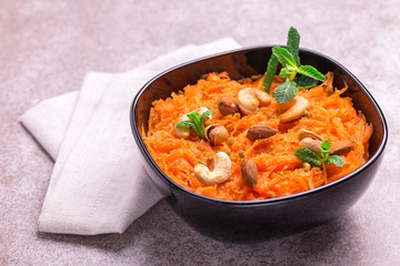Indian carrot Gajar halwa. Copyspace, horizontal view, flatlay.