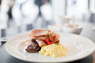 Bacon, sausage and eggs breakfast