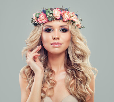 Portrait of Beautiful Young Model with Floral Hairstyle