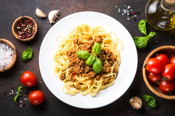 Spaghetti bolognese  on dark stone table.