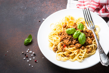 Spaghetti bolognese  on dark stone table.