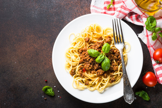 Spaghetti bolognese  on dark stone table.