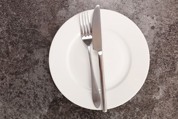 clean white plate and cutlery