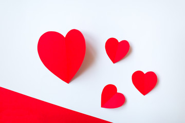 Valentine day background with red hearts, top view. White background with copy space.