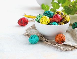 Colored easter eggs on a light background,place for text