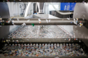 recycled plastic bottles and waste at the plant