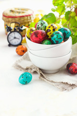 Colored easter eggs on a light background,place for text